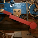 Maintaining power lever, completed, resting over winding peg.